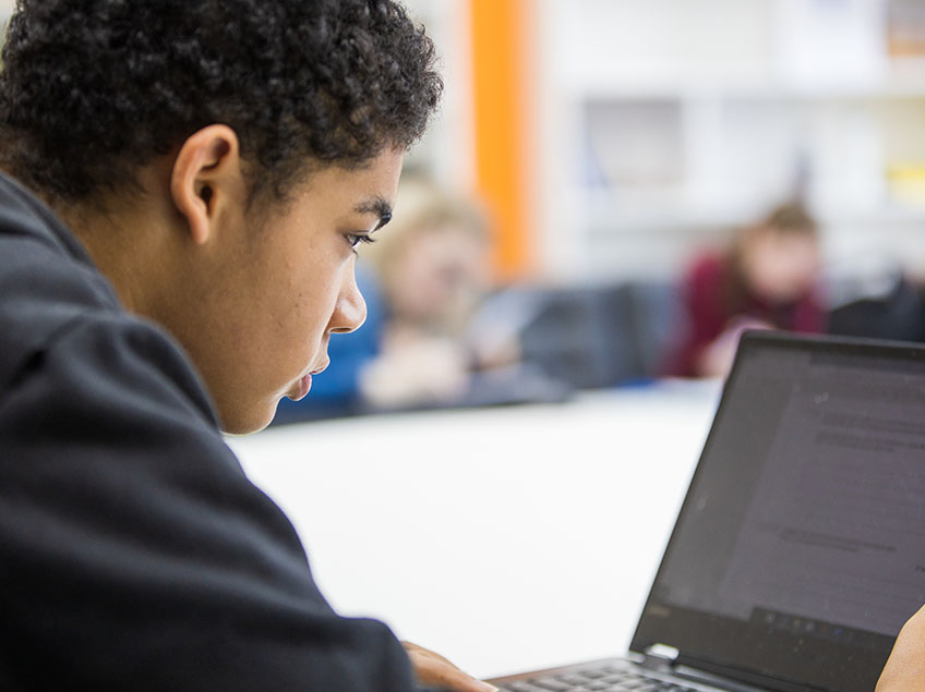 Student looking at a laptop